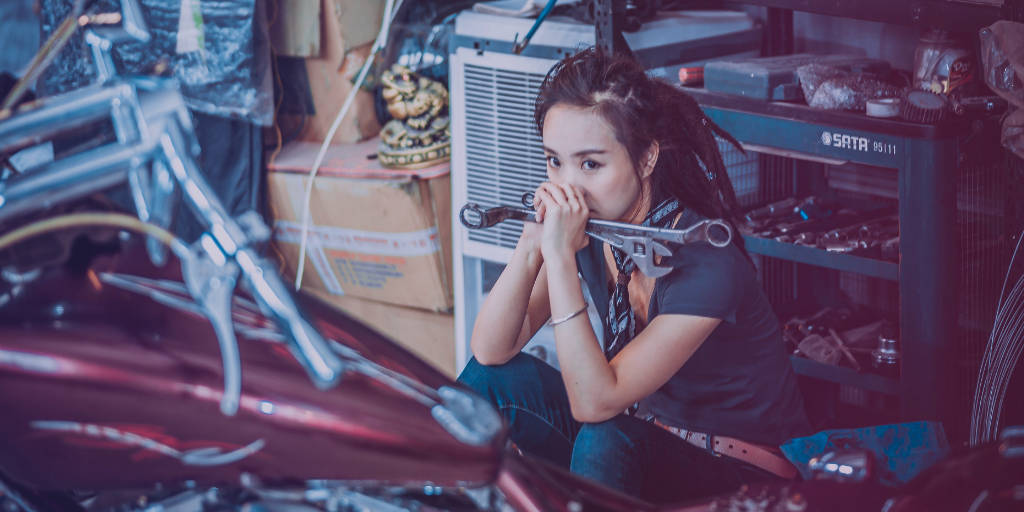Female Mechanic Holding Tools | Retail Shift Episode 8: How to Fix Your High Maintenance Business Partnerships | Hosted by Chris Guillot of Merchant Method | Subscribe at merchant.tips/podcast