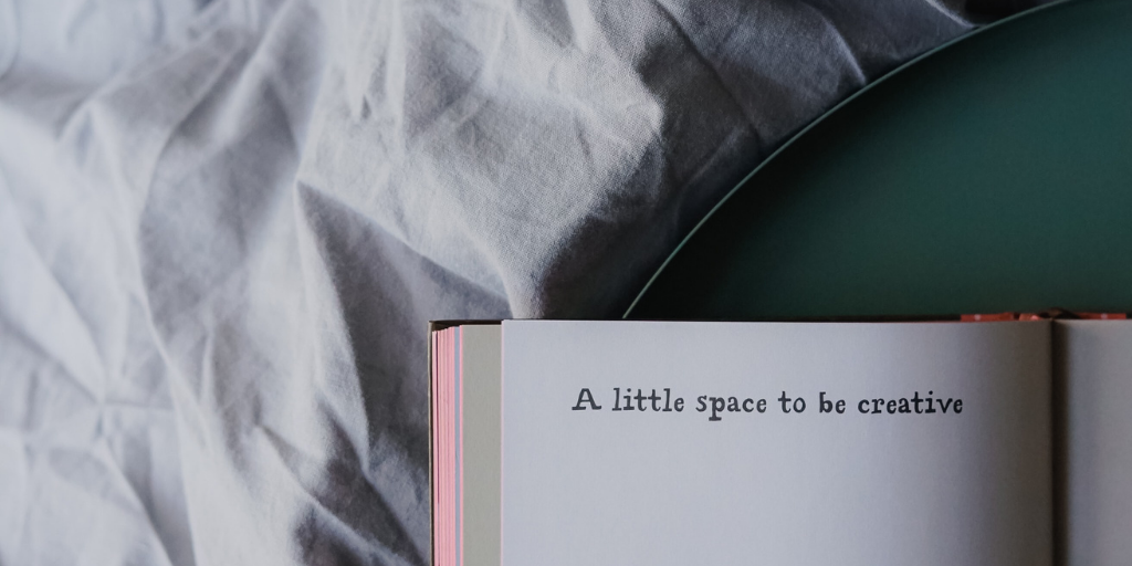 A book laying on a bed stating 