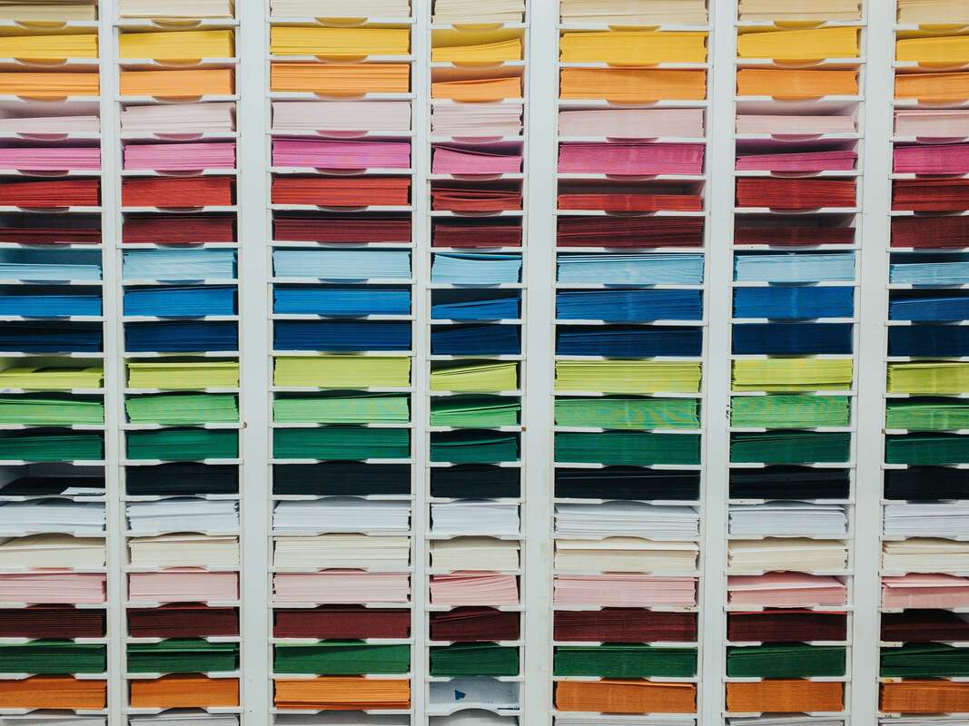Reams of colored paper organized